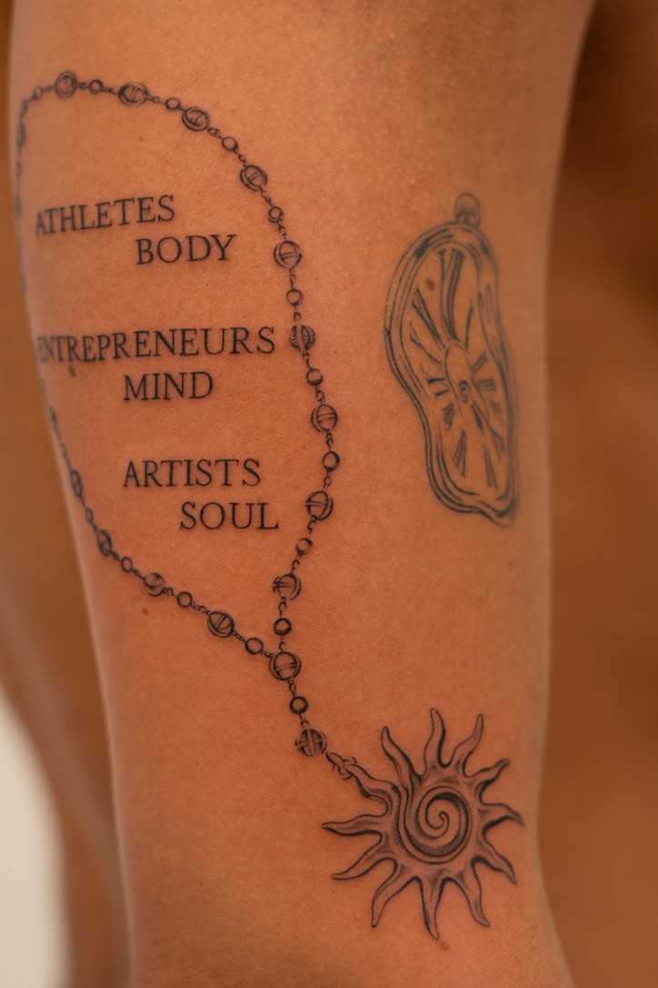 Detailed upper-arm tattoo composition